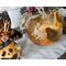 This shows the side of the pumpkin gourd that has a scar carved into the shell. The scar is stitched up with a hemp cord.